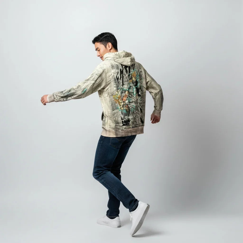 Man wearing a graphic print hoodie with floral design, blue jeans, and white sneakers