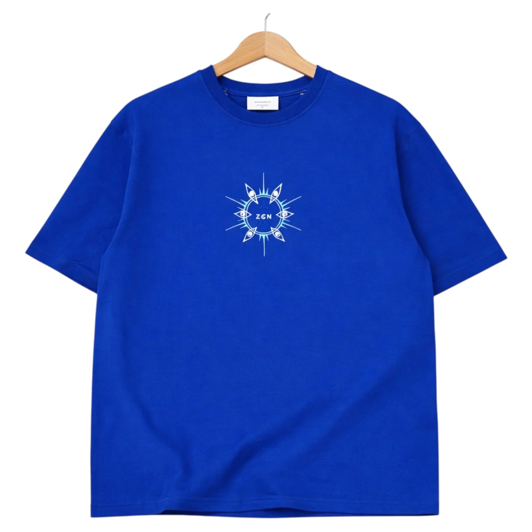 Blue graphic t-shirt with central white eye and sunburst design, ZGN text in center