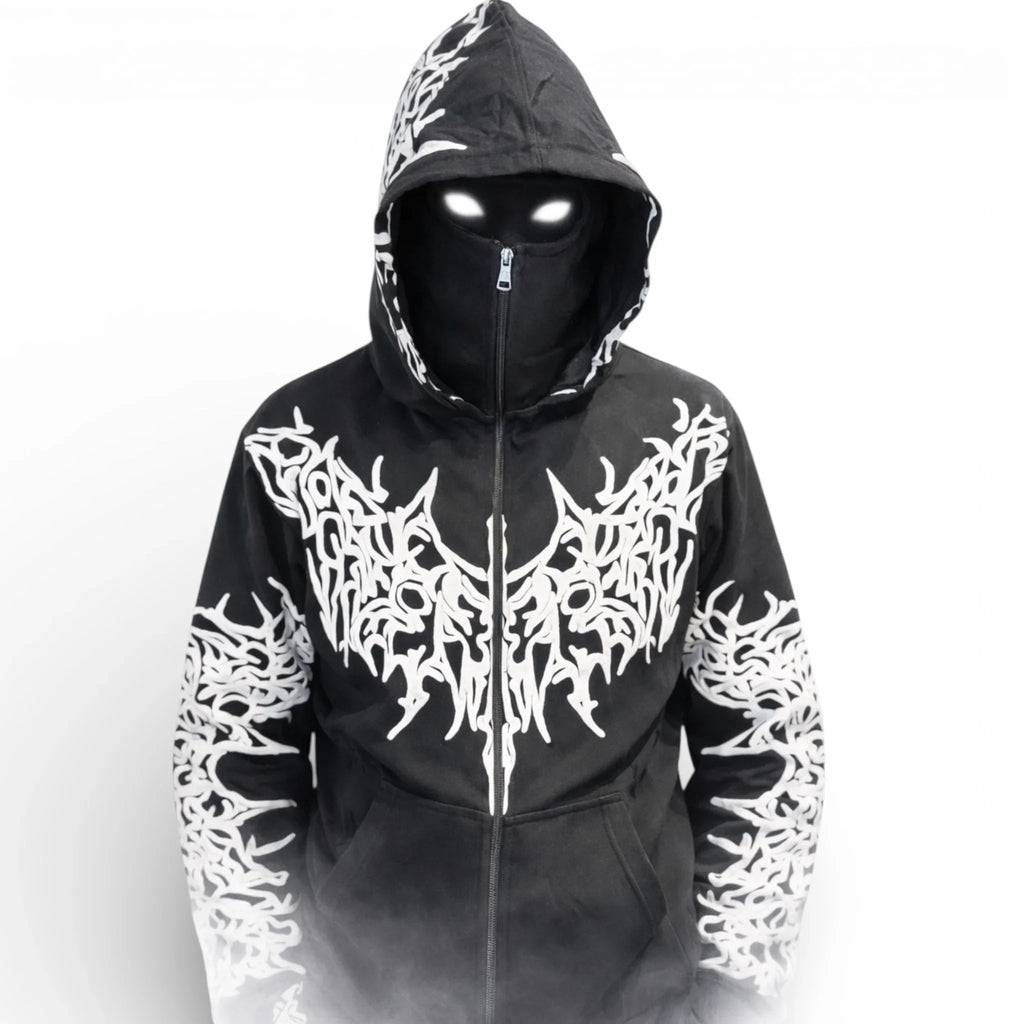 Person in black hoodie with bold white graphic designs, hood up, mask, and glowing eyes