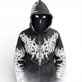 Person in black hoodie with bold white graphic designs, hood up, mask, and glowing eyes