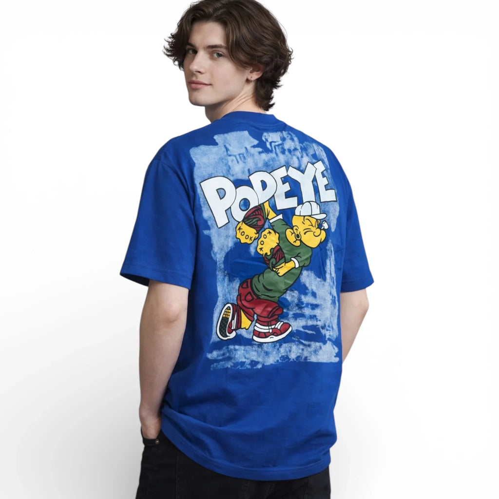 Man wearing blue graphic T-shirt with cartoon character and bold PODEYE text on back
