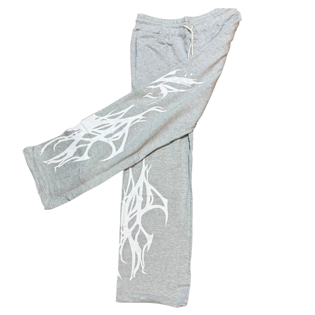 Gray sweatpants with white tribal graphic design on both legs, drawstring waist
