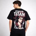 Man wearing black Attack on Titan anime graphic t-shirt with character illustration on back